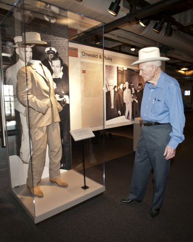 Retired Dallas Police detective Jim Leavelle views the tan-colored suit he was wearing when Lee Harvey Oswald was shot. The suit is now on display at The Sixth Floor Museum at Dealey Plaza along with other original artifacts from the shooting. Rhonda Hole / The Sixth Floor Museum at Dealey Plaza