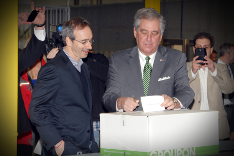 Groupon CEO Eric Lefkofsky (left) and Kentucky Lieutenant Governor Jerry Abramson sign a card for the recipient of the first package being sent from the new Groupon Goods Fulfillment Center in Hebron, Ky. today. The two also took part in the ribbon-cutting ceremony at the fulfillment center, Groupon's first warehouse. Nov. 18, 2013. Photo by Rick Lucas.