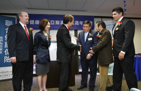 Alhambra Vice Mayor Stephen Sham (third from right) presents a certificate of recognition to Chris Law (third from left), UnitedHealthcare national vice president, during the reopening of UnitedHealthcare's newly renovated Asian Plaza store in Alhambra. Looking on, from left to right: Mike McCarthy, UnitedHealthcare regional vice president; Mamie Lee, business manager, UnitedHealthcare's Asian Plaza in Alhambra; and Alhambra council members Gary Yamauchi and Luis Ayala (Photo: Jamie Rector).