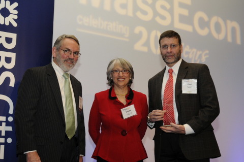Paul Cormier (far right), president, Products and Technologies, Red Hat, accepts the Northeast Gold award from MassEcon Executive Director, Susan Houston, and Chairman, Fred Mulligan, during the 10th annual Team Massachusetts Economic Impact Awards ceremony. Photo courtesy of Janet Stearns.