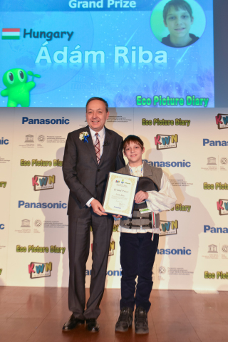 Eco Picture Diary Grand Prix winner receiving the trophy from Chairman and CEO of Panasonic Europe,  ... 