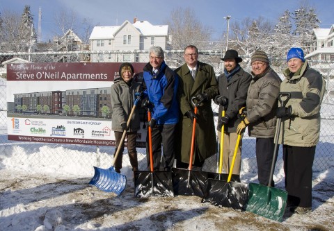Development partners celebrate the official groundbreaking of the Steve O'Neil Apartments with County Commissioner Angie Miller (wife of Steve O'Neil) in Duluth. L to R: Commissioner Miller; Warren Hanson, Greater Minnesota Housing Fund/MEF; John Miklausich, UnitedHealthcare; Jeff Corey, 1 Roof Community Housing; Rick Klun, Center City Housing Corporation; and Lee Stuart, Executive Director, CHUM (Photo: Michael K. Anderson Photography).