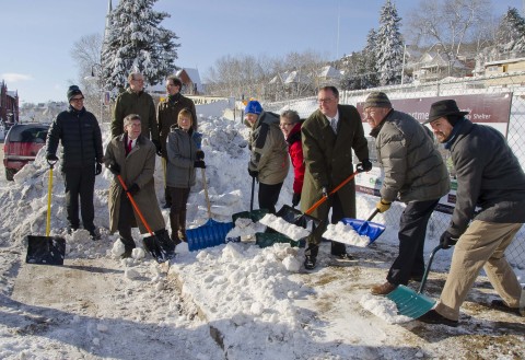 Supporters and development partners shovel snow to celebrate the official groundbreaking of the Steve O'Neil Apartments in Duluth. L to R: Erik Torch, Northland Foundation; Rick Ball, Duluth Housing and Redevelopment Authority; Doug Zaun, Wagner Zaun Architecture; County Commissioner Frank Jewel; County Commissioner Angie Miller (wife of Steve O'Neil); Lee Stuart, CHUM; Julie Hillman, 1 Roof Community Housing; John Miklausich, UnitedHealthcare; Rick Klun, Center City Housing Corporation; and Jeff Corey, 1 Roof Community Housing (Photo: Michael K. Anderson Photography).