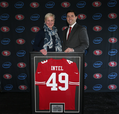 Intel Chief Marketing Officer Deborah Conrad and San Francisco 49er CEO Jed York with commemorative  ... 
