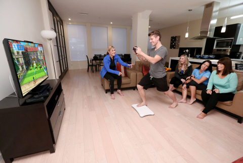 In this photo provided by Nintendo of America, TJ Smith from Los Angeles plays Wii Fit U's "Hosedown," one of several new activities in the game that use the Wii U GamePad controller. Prior to the game's retail launch on Jan. 10, a few select Nintendo fans had the opportunity to participate in Nintendo's "Wii Fit U Challenge," which encourages Wii U owners and families to incorporate the game into their busy schedules as a fun and convenient way to stay active throughout the year. (Photo: Business Wire)
