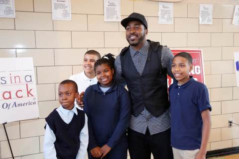 New York Giants Hakeem Nicks with some of the more than 50 students from PS 15 who participated in an afternoon of health education and physical fitness to kick off the second year of a collaboration between UnitedHealthcare and Nicks' nonprofit, Helping Hands. The organization provides backpacks of healthy foods and snacks for in-need children to take home over the weekends, when they may not otherwise have access to nutritious meals, through organizations like Blessings in a Backpack, which also joined in the afternoon's activities (Photo: Joe Rosen/PhotoBureau Inc.).