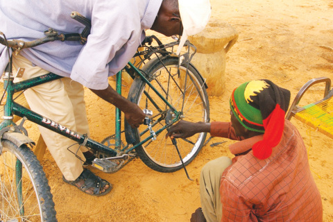 Orphanage workers in Uganda attach the generators to bicycles to charge batteries that power cell phones and other devices. (Photo: Stratasys)