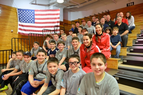 Youth from the Town of Poughkeepsie's Babe Ruth League - Cal Ripken Division attended a Marist College basketball game in celebration of the United Water and Cal Ripken, Sr. Foundation Badges for Baseball program. Representatives from United Water and Town Supervisor Todd Tancredi played in the children's Quickball tournament as part of the celebration. (Photo: Business Wire)
