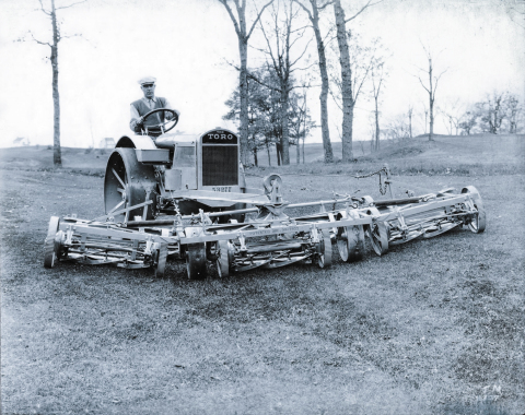 Mounting five lawn mowers onto the front of a farm tractor, Toro develops the Standard Golf Machine in 1919 and helps create the motorized golf course equipment industry. (Photo: Business Wire)