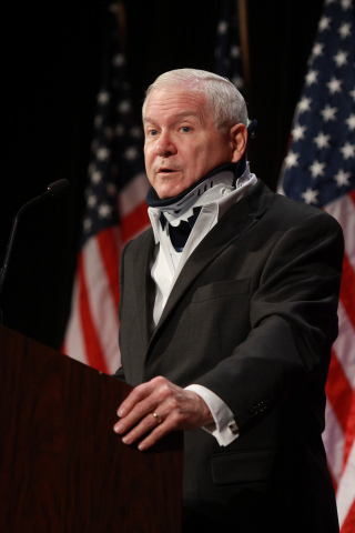 2014 Winter NAPE Charities Industry Luncheon keynote speaker, former U.S. Secretary of Defense Robert Gates, addresses NAPE attendees at its annual fundraising event where 100 percent of ticket sales and sponsorships are donated to charities that aid U.S. Veterans. This year, NAPE has selected four worthy charities to receive the monies raised: the Mission Continues, Support-A-Soldier, Canine Companions for Independence and the Lone Survivor Foundation. Former Navy Seal and Lone Survivor founder Marcus Luttrell was also on hand to personally receive the donation. To date, the NAPE Charities Industry Luncheon has raised more than $4 million for deserving charities supporting American veterans. Photo Credit: Gary Fountain