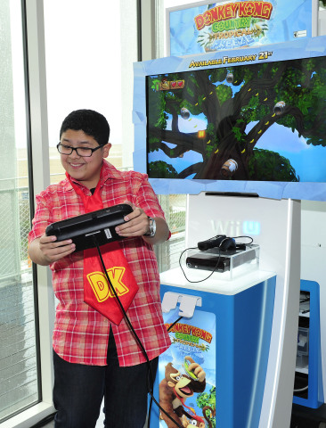 In this photo provided by Nintendo of America, Rico Rodriguez of Modern Family enjoys playing Donkey Kong Country: Tropical Freeze for Wii U at the Annenberg Beach House in Santa Monica, Calif., on Feb. 6, 2014, to celebrate the Feb. 21 launch of the latest installment of the beloved Donkey Kong franchise. In the new game, Donkey Kong and his friends take on a horde of icy invaders who are freezing their tropical island home. Donkey Kong Country: Tropical Freeze for Wii U features beautiful high-definition graphics as well as off-screen play using the Wii U GamePad.