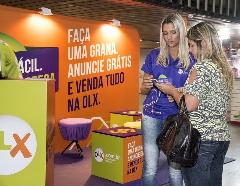 An OLX kiosk in use. (Photo: Business Wire)