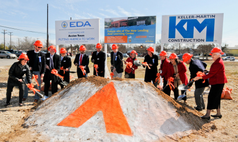 Accion Texas President and CEO Janie Barrera (wearing red, in center) is joined by board members, civic leaders and donors February 12 during the groundbreaking ceremony for the new Accion Texas Lending and Learning Center to be located at 2015 W. Martin Street on the West Side of San Antonio in the historic Prospect Hill neighborhood. The new center should open in 2015. (Photo: Business Wire)