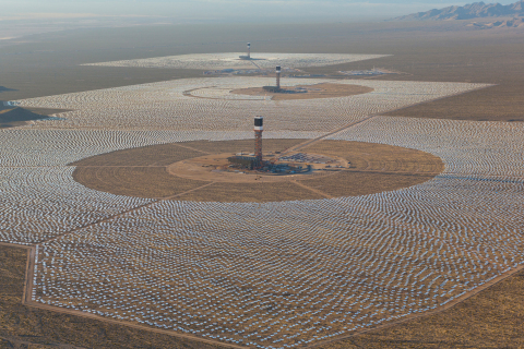 An aerial view of the Ivanpah Solar Electric Generating System with Tower 3 in the foreground, Tower 2 in the middle and Tower 1 in the background. The towers are surrounded by 173,500 heliostats that follow the sun's path.(Photo: Business Wire)