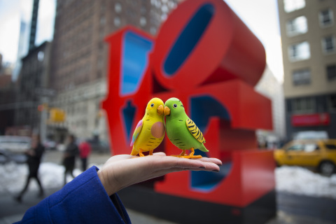 Thursday's Nor'easter didn't stop these two love birds from Moose Toys' Little Live Pets line from migrating north for the 111th American International Toy Fair, which opens on Sunday, February 16 at the Jacob K. Javits Convention Center. Moose Toys, creators of The Ugglys(TM), will introduce Little Live Pets(TM) Birds (pictured here atop NYC's iconic LOVE sculpture) at the trade show. (Photo: Business Wire)