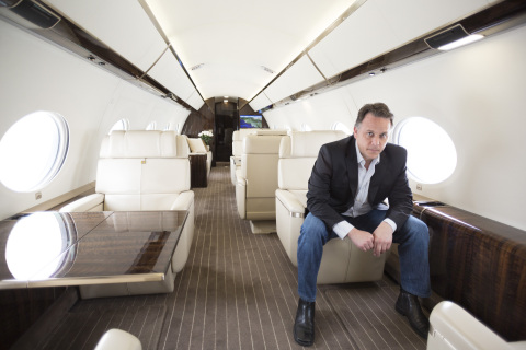 Jet Edge CEO Bill Papariella inside the cabin of company's new G650 aircraft. (Photo: Business Wire)