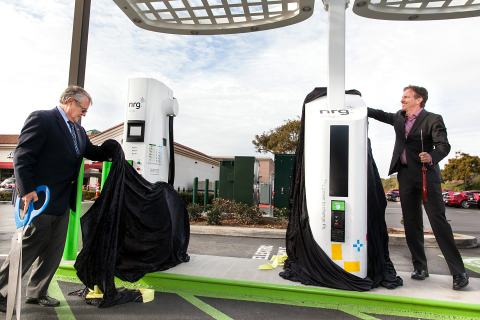 Mayor Matt Hall from the City of Carlsbad and Terry O'Day, Vice President of NRG eVgo California, display the brand new Freedom Station for charging electric cars at Carlsbad Premium Outlets in California (Photo: Business Wire)