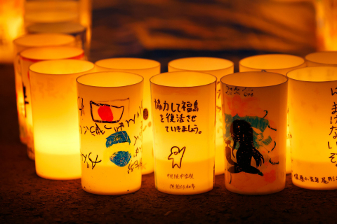 "Let's work together to revitalize Fukushima" - A scene at "Candle Night: Lights of Hope" (Photo: Business Wire)
