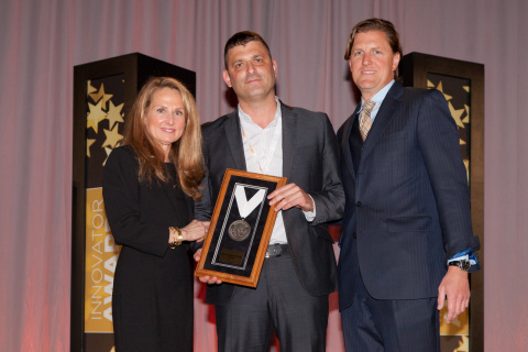 Presenting a 2014 award for "Best Comeback Story" to Shlomi Eytan (center), oti global vice president of sales and marketing, is Karen Webster (left) founder and President of PYMNTS.com, and Tim Attinger (right), Strategy, Corporate Development and Digital Innovation for Blackhawk Network. oti is a global provider of NFC and cashless payment solutions. Photo courtesy of Richard Pasley.