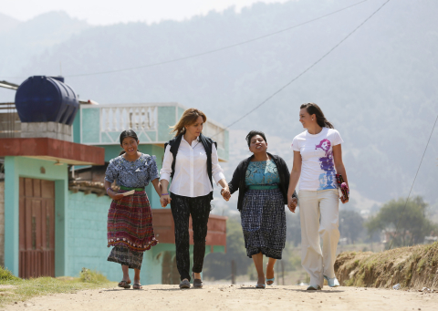 Angelica Fuentes, CEO of Omnilife and Founder of Angelissima, second left, and Olympic gold medalist, Rebecca Soni, right, share experiences with girls from Paxtoca during a visit from Girl Up, a campaign of the United Nations Foundation, during a trip to Guatemala, to learn more about UN programs that help adolescent girls receive an education, see a doctor, and stay safe from violence, Guatemala, April 18, 2013. (INSIDER IMAGES/Stuart Ramson for UN Foundation)