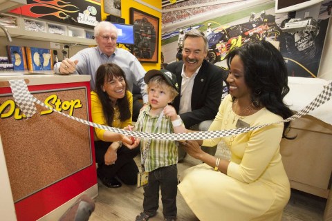 Ribbon Cutting Ceremony at Children's Blood and Cancer Center in Austin, TX. Front Row Lt to Rt: Trish Kriger, Jeff Gordon Children's Foundation; Toddler Patient; Lisa Miree-Luke, Axalta Coating Systems. Back Row Lt to Rt: Bill Murray, Austin Promise Circle; W. Gaines Bagby, CBRE, Inc. (Photo: Business Wire)