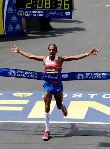 Meb crossing the finish line in his signature Skechers GOmeb Speed 3 shoes for the win at the 2014 B ... 