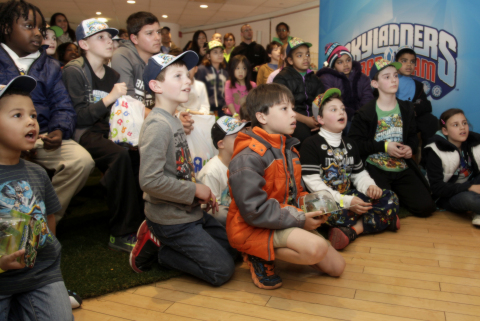Kids react to a special reveal of Skylanders Trap Team as part of Skylanders Day on April 23, 2014 in New York City at Toys"R"Us Times Square, where consumers were the first in the world to experience Skylanders Trap Team before the general public. Skylanders Trap Team, the newest video game in the popular Skylanders franchise, reverses the magic of bringing toys-to-life with ground-breaking innovation that allows kids to pull the characters out of the digital world into the physical world. (Photo by Andy Kropa/ Invision for Activision /AP Images)