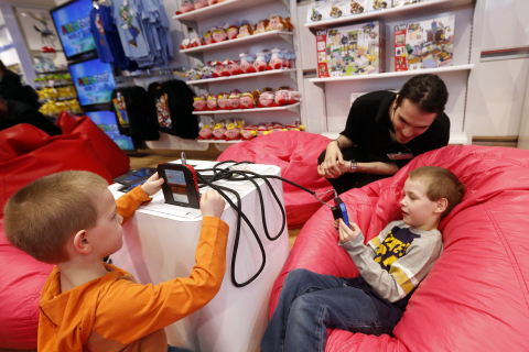 In this photo provided by Nintendo of America, attendees visit Nintendo World on Saturday, April 26, 2014, in New York, to play new games for the portable Nintendo 2DS hand-held system, including Kirby: Triple Deluxe. Kirby is one of the most beloved and recognizable characters in the Nintendo universe. Since the first game in the series, the lifetime sales of all Kirby games total more than 10 million units in the U.S. alone. (Photo by Jason DeCrow/Invision for Nintendo/AP Images)
