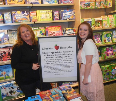 Sarah Morris, a Social Studies/History teacher at the Hazelbrook Middle School in Tualatin, Oregon, has been named the winner of the Barnes & Noble National Teacher of the Year award. Ms. Morris was nominated by her former student Ayslinn Buchholz and was chosen from more than 9,100 nominees nationwide for this honor. Ms. Morris was also named a regional winner. Pictured here are Ms. Morris and Miss Buchholz celebrating the contest at a special event held at the Barnes & Noble store in Bridgeport, Oregon.