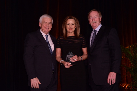 Sandra Perkins is congratulated by GEICO Chairman and CEO Tony Nicely (left) and GEICO president and COO Bill Roberts after being named GEICO new field representative of the year. (Photo: Business Wire)