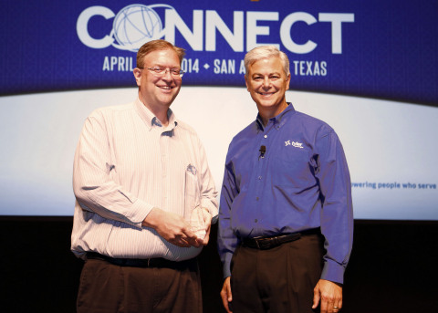 Casey Kennedy of the Texas Office of Court Administration accepts a Tyler Excellence Award from Bruce Graham, president of Tyler's Courts & Justice Division. (Photo: Business Wire)