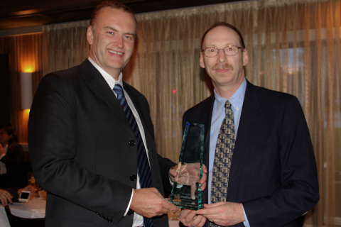 John Molloy, Divisional Chief Executive, TT Electronics-IMS, receives the Thermo Fisher Scientific Supplier of the Year Award from Peter Granick, Vice President of Global Sourcing for Thermo Fisher. (Photo: Business Wire)