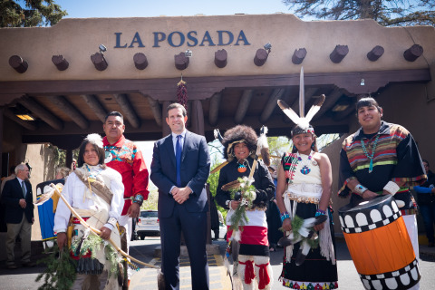 Joe Smith, (center) owner of La Posada de Santa Fe, with members of the Tesuque Pueblo at the flag celebration marking the hotel joining Starwood's The Luxury Collection of hotels. Travis Vigil, Tesuque Tribal Council Member, (left) offered a traditional Native American blessing on the hotel. (Photo: Business Wire)