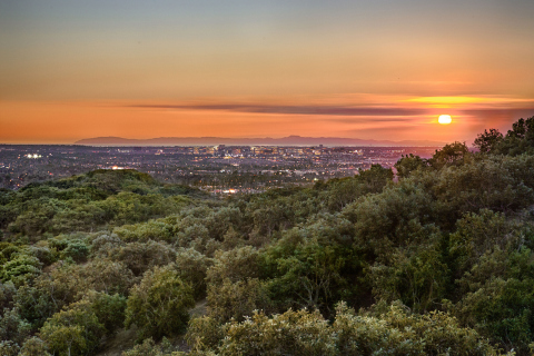 View from Orchard Hills: new village set against the majestic backdrop of Loma Ridge, thousands of acres of open space and working avocado groves (Photo: Business Wire)

