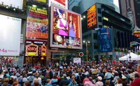 Scores of Broadway fans enjoy a past year's Tony Awards simulcast in Times Square hosted by Clear Channel Spectacolor (Photo: Business Wire)