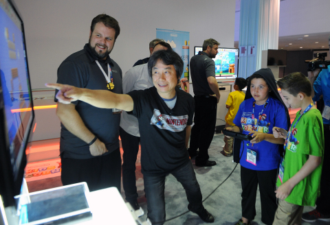 In this photo provided by Nintendo of America, Oscar, age 11, and Noah, age 13, join Shigeru Miyamoto, the creator of Super Mario Bros. and The Legend of Zelda, for a collaborative game play session with Mario Maker (working title), an upcoming game for the Wii U console unveiled at the E3 trade show in Los Angeles. For the first time ever, Nintendo is giving the world a glimpse of the thrill of E3 through the eyes of a child by welcoming a select group of kids to the Nintendo Kids Corner event at the Nintendo booth at E3. They enjoyed an exclusive, insider's look at the latest games announced for the Wii U console and the Nintendo 3DS system.