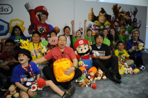 In this photo provided by Nintendo of America, a select group of kids enjoy meeting video game luminaries Shigeru Miyamoto, the creator of Super Mario Bros. and The Legend of Zelda, Takashi Tezuka, the creator of Yoshi games and Tsunekazu Ishihara, president and CEO of The Pokémon Company International. They got hands-on time with the hottest new games for the Wii U console and the Nintendo 3DS system, including a world-exclusive look at Fossil Fighters Frontier, an upcoming game for the Nintendo 3DS system launching in 2015.