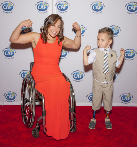 CAF athletes Alana Nichols and Braylon O'Neill show their strength at the 2014 "A Celebration of Heroes, Heart and Hope gala in New York City. (Photo: Business Wire)