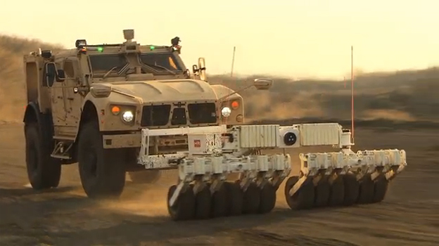 The Oshkosh® M-ATV equipped with TerraMax UGV and a mine roller (pictured) is capable of autonomous navigation for route clearance missions. 