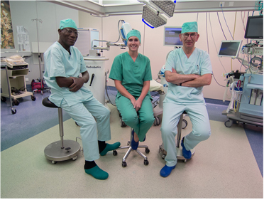 Professor George Lawson, Sandy Leman, INF & Professor Marc Remacle immediately following the use of the Flex® System, a first of its kind flexible robot system. (Photo: Business Wire) 