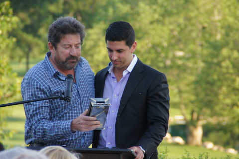 Al Berg (left), CEO of Marchon Eyewear and Vice President of the MIY JCC's Board of Directors, presented Mr. Joshua Sason with a handcrafted Tzedakah box in honor of his key role in the continued success and growth of the organization. (Photo: Business Wire)