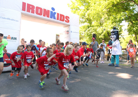 UnitedHealthcare mascot Dr. Health E. Hound is pictured at the finish line of the UnitedHealthcare IRONKIDS Syracuse Fun Run at Jamesville Beach Park today. Nearly 100 youth participated in the race for “triathletes to be.” Photo Credit: Michael J. Okoniewski