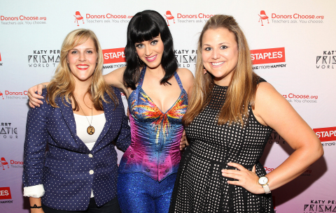 Local teachers Julie Rukavina (left) and Michelle Lee (right) backstage at the Verizon Center with Katy Perry after her Prismatic World Tour performance on Tuesday, June 24, 2014, in Washington, DC. As part of its $1 million dollar donation to online charity DonorsChoose.org, Staples, Inc. announced that it has fully funded the balance of every project that was on DonorsChoose.org in the Washington, D.C. community. This $43,994 donation helped 47 teachers fulfill classroom needs and helped more than 3,900 students in the D.C. public school district. Katy Perry teamed up with Staples, Inc. and DonorsChoose.org to 'Make Roar Happen' and support teachers during this back-to-school season. (Photo by Paul Morigi/Invision for Staples/AP Images)