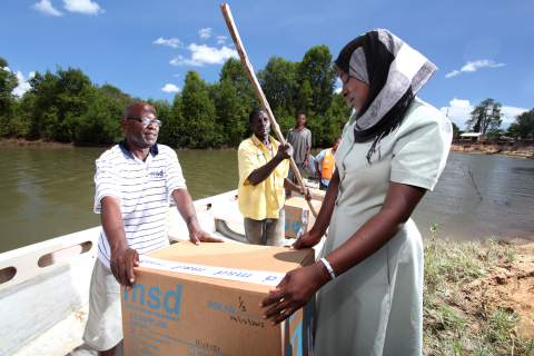 The Medical Stores Department (MSD) in Tanzania delivers medicines to a clinic via boat in the Rafiji Delta region of Tanzania's Pwani District. MSD is the government agency in Tanzania responsible for procuring, storing and delivering medicines throughout the country. In the rainy season, MSD uses boats to access rural clinics. Since Project Last Mile launched in 2010, MSD's distribution system has expanded to include delivery to more than 5,500 health facilities. Previously, MSD delivered to approximately 150 district warehouses, thus losing sight of the last mile. (Photo: Business Wire)