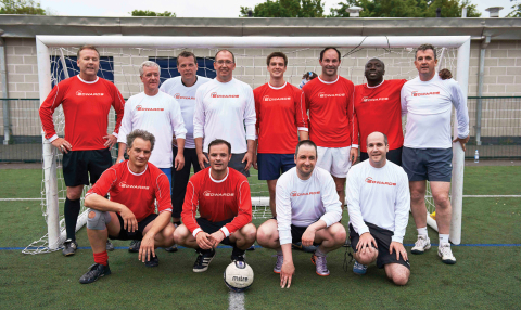 Geert Follens, President of Vacuum Solutions Division, pictured 4th from left, back row, with management and staff from Edwards who took part in a charity football match. (Photo: Business Wire)

