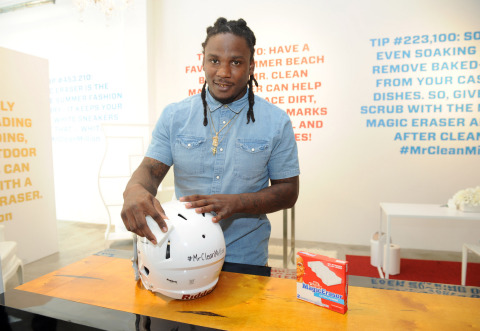 New York Jets running back Chris Johnson uses the Magic Eraser to clean a football helmet at the Mr. Clean Summer Fashion party, Tuesday, July 1, 2014, in New York. The event, hosted by stylist Brad Goreski, showcased that there are about a million uses for the famed Magic Eraser, including those in fashion, beauty and beyond. (Diane Bondareff/Invision for Mr. Clean)