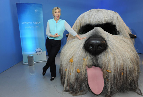 Emmy award-winning actress Jane Lynch holds dog Baby Hope at a Febreze event to shed light on a little known condition: noseblindness and to encourage dialogue about what your guests really smell, Wednesday, July 9, 2014, in New York.  Check out her Funny or Die video on the topic at noseblind.com.  (Photo by Diane Bondareff/Invision for Febreze)