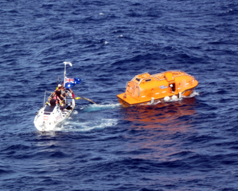 Nordic River launch boat (R) evacuates injured rower from Avalon rowboat (L) during Indian Ocean rescue led by Global Rescue on July 11. COURTESY OF: LPGC ”Nordic River” “K”Line Ship Management Co., Ltd. (Tokyo, Japan)