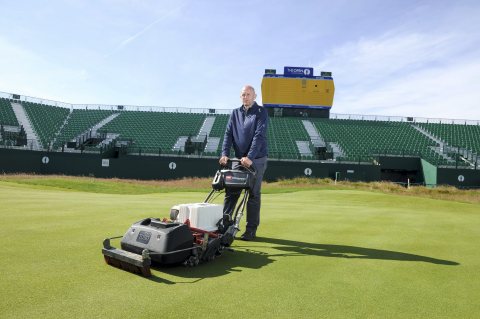Craig Gilholm, course manager at Royal Liverpool Golf Club, with Toro's eFlex lithium ion battery-powered greensmower. (Photo: Business Wire)