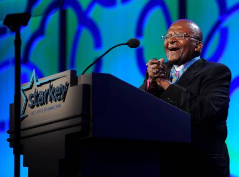 Gala honoree Archbishop Desmond Tutu speaks at the Starkey Hearing Foundation's "So the World May Hear" Awards Gala on Sunday, July 20, 2014 in St. Paul, Minn. The foundation gives away more than 100,000 hearing aids in the U.S. and around the world annually. (Photo by Diane Bondareff/Invision for Starkey Hearing Foundation/AP Images)
